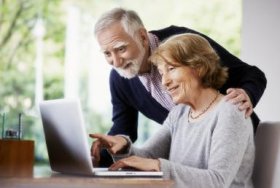 Senior couple at home using a laptop - Oliver Rossi/The Image Bank/Getty Images